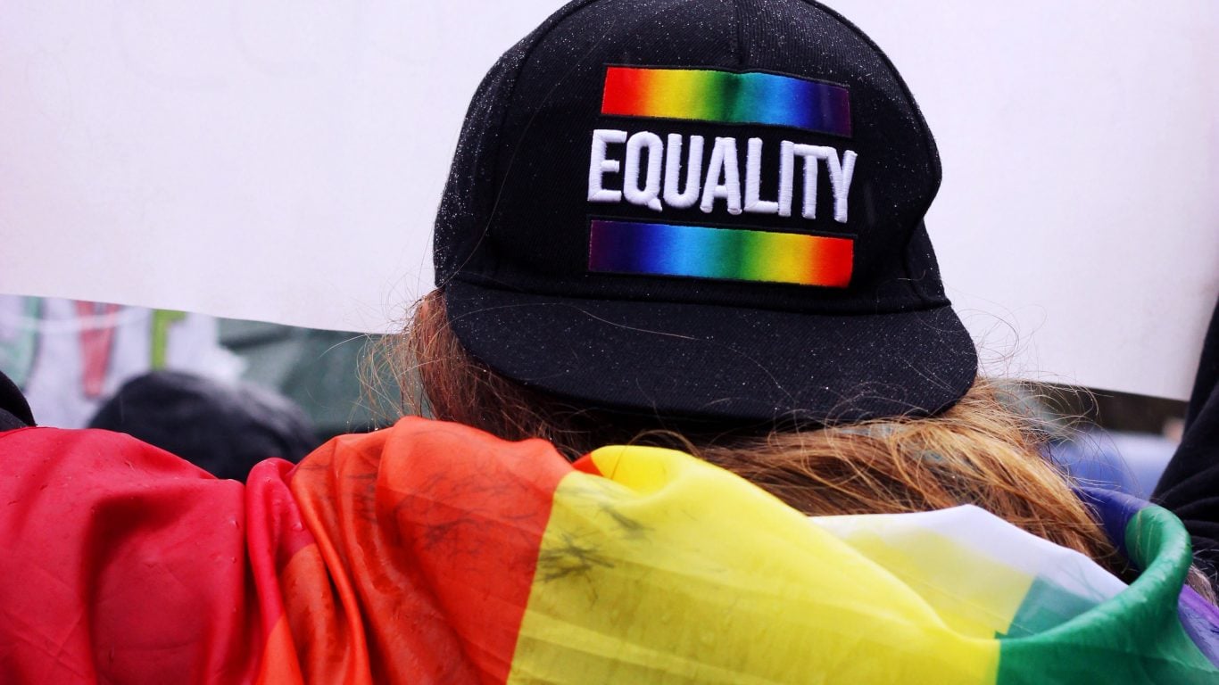 Back of head of someone wearing a Pride Equality baseball cap