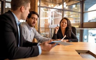 Professional meeting between three colleagues led by female