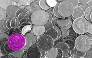 Stack of coins with a lower left coin highlighted in purple