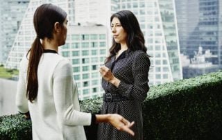 Two women conversing outdoors