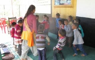 Teache and students at Nathkhol school