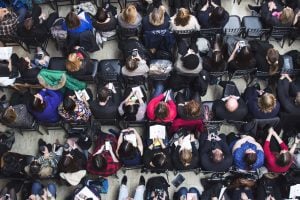 Overhead shot of audience members watching the "Journalism and the #Metoo moment" event