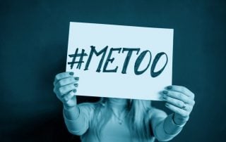 Woman holding a #MeToo sign