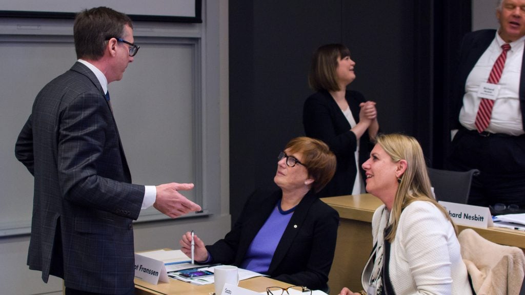 Discussion between three attendees at the Industry Partner Workshop | February 2018