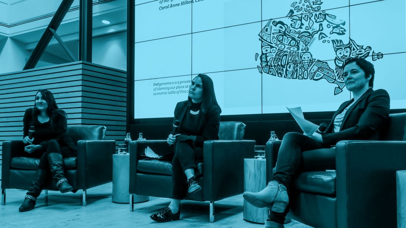 Speakers sat on stage at the Indigenous Women Event hosted by the Institute for Gender and the Economy