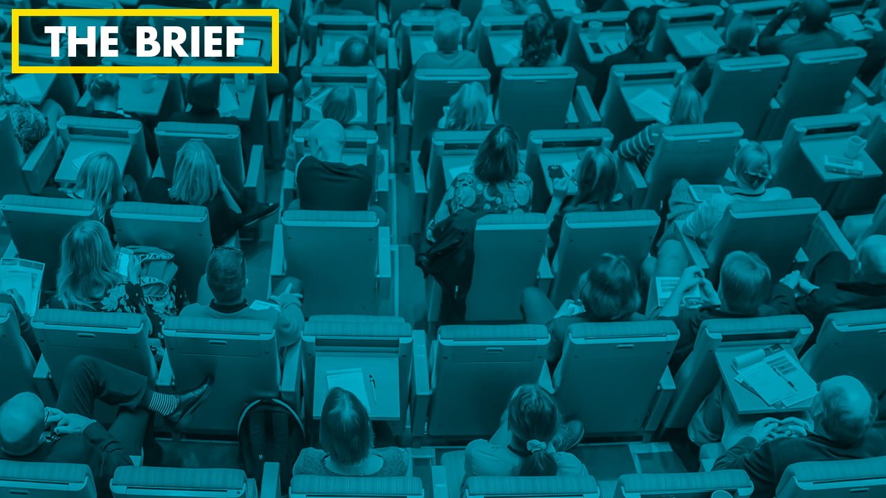 Overhead shot of seated conference attendees