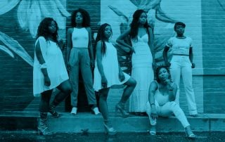 Six confident black women pose