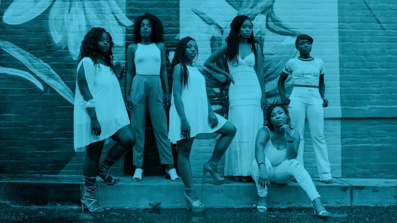 Six confident black women pose