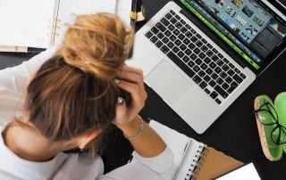 Woman looking down at her computer