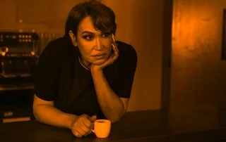 Woman in coffee shop - gender wage gap