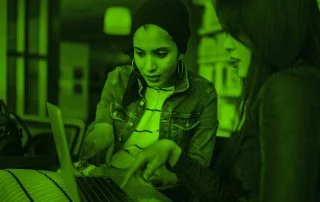 Two women working on a computer