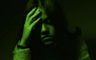Woman with her head in her hands