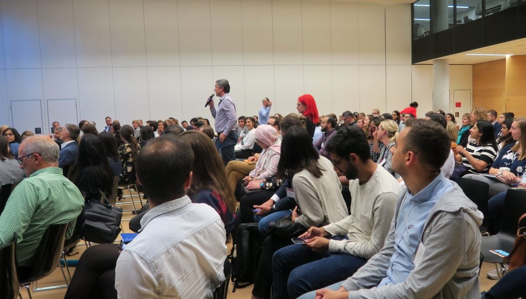 An audience member asks Sarah Kaplan a question at "The 360° Corporation" event