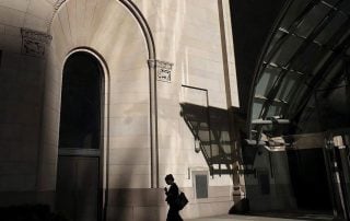 Woman walking into building