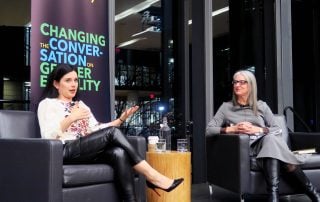 Robyn Doolittle and Sarah Kaplan sit on stage