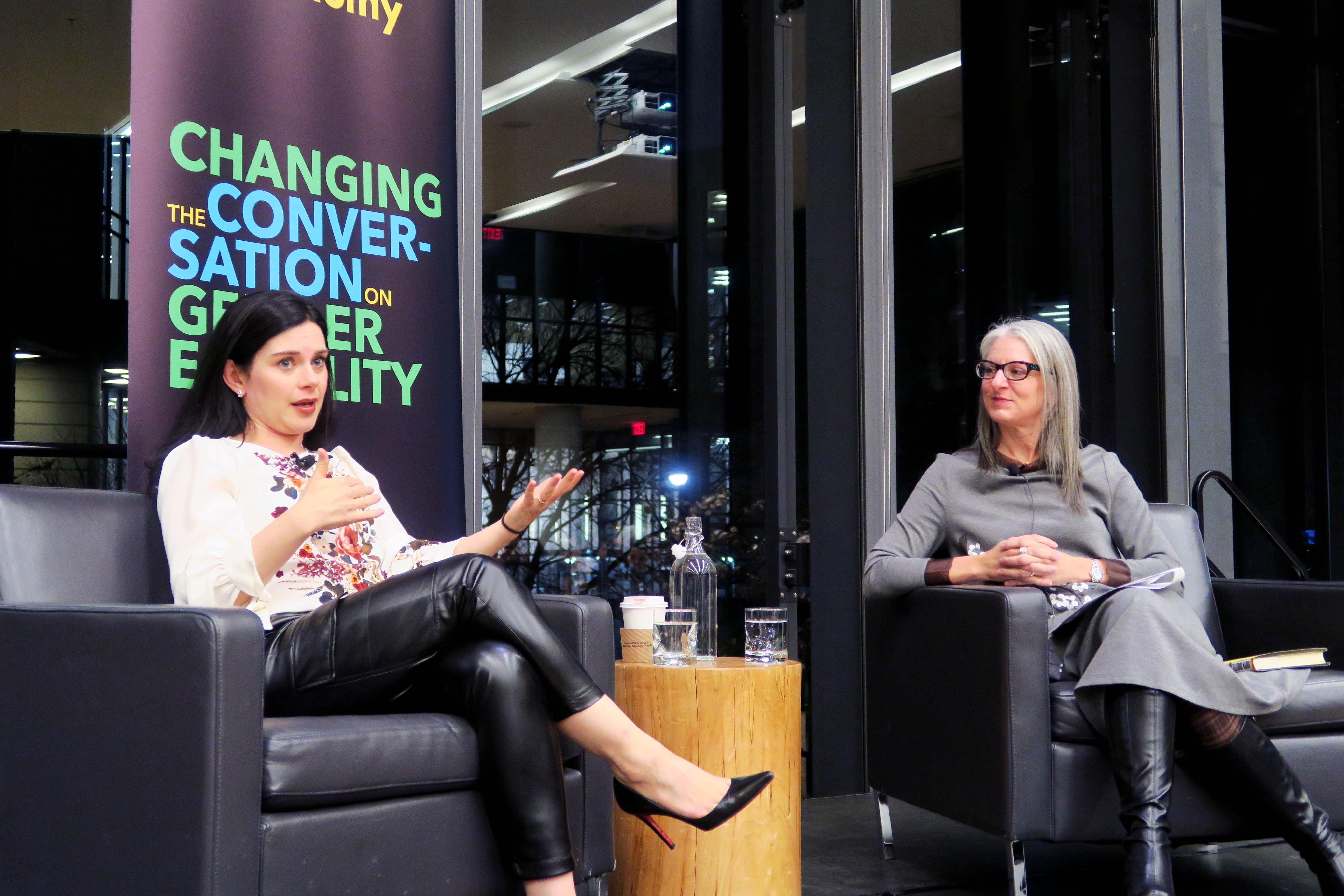 Robyn Doolittle and Sarah Kaplan sit on stage