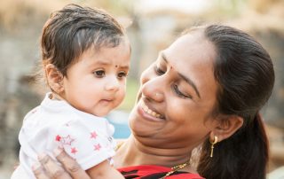 Mother holding child in Rural India