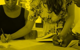 Three people working at table