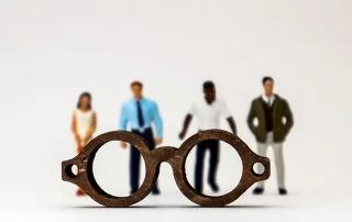 figures of four people looking through an intersectional lens