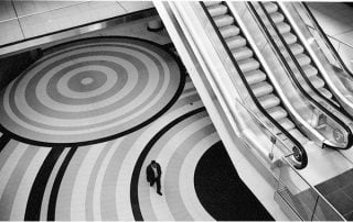 Aerial shot of escalators with single person walking by
