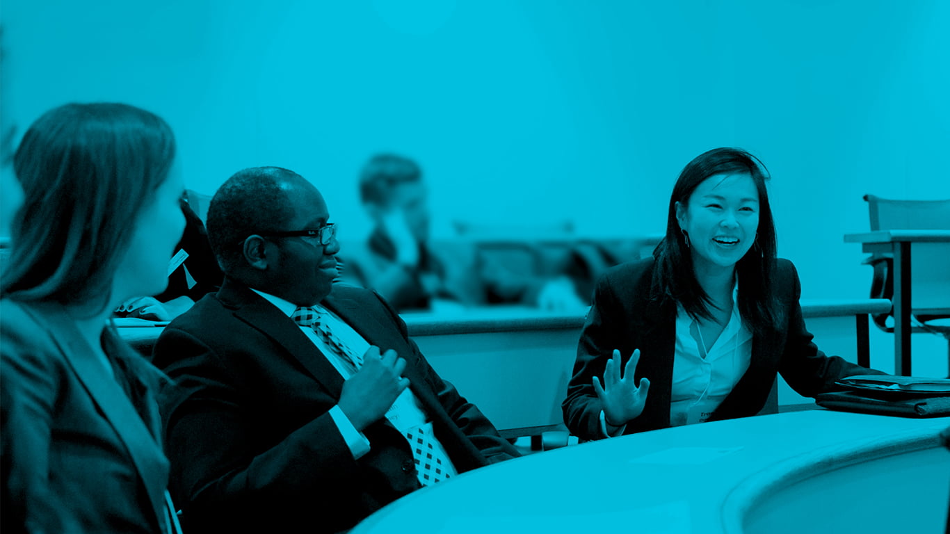 Three colleagues sat at table