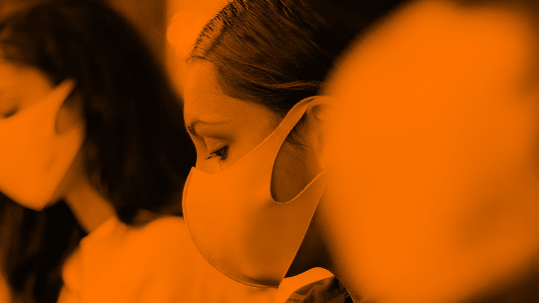 Closeup of three women wearing masks