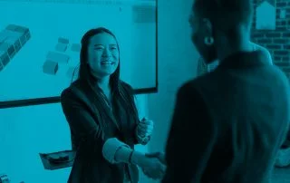 Two women shaking hands