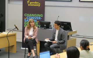 Andrew Leon Hannah reading a passage from a book, while Rachel Pulfer watches on